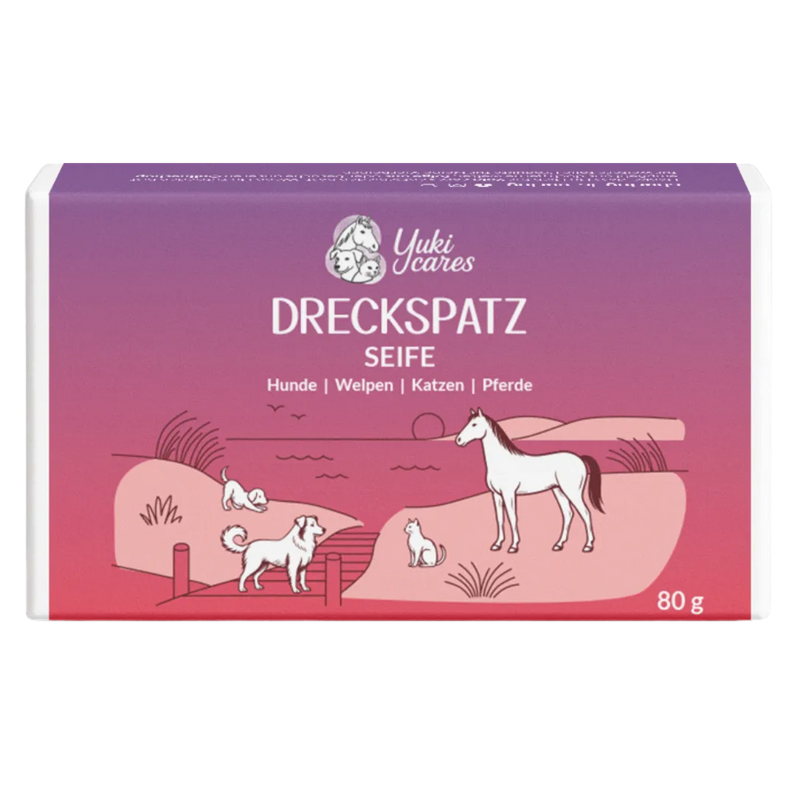 Die Verpackung der Dreckspatz-Seife zeigt ein idyllisches Ufermotiv mit Hund, Katze und Pferd in einer lila-roten Abendstimmung.