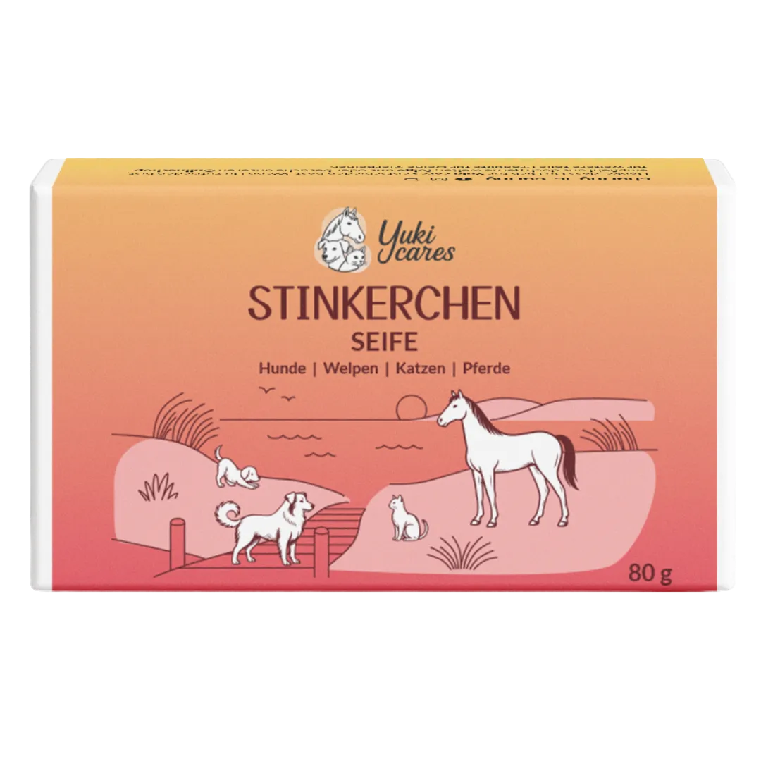 Eine Verpackung von "Stinkerchen Seife" zeigt Tiere wie Hunde, Katzen und ein Pferd in einer idyllischen Landschaft.