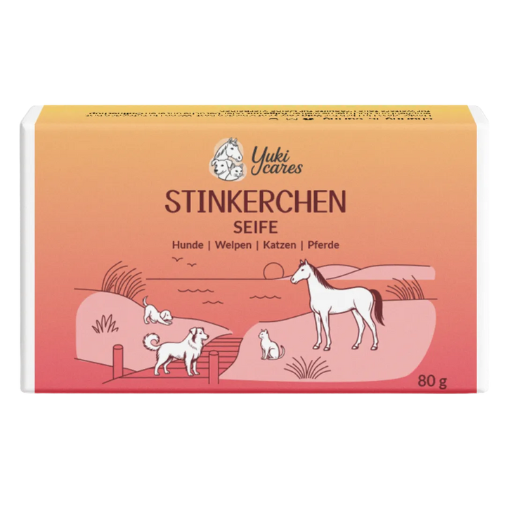 Eine Verpackung von "Stinkerchen Seife" zeigt Tiere wie Hunde, Katzen und ein Pferd in einer idyllischen Landschaft.