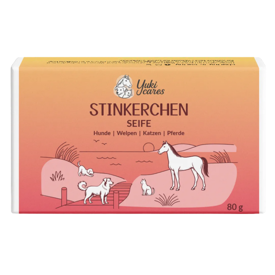 Eine Verpackung von "Stinkerchen Seife" zeigt Tiere wie Hunde, Katzen und ein Pferd in einer idyllischen Landschaft.