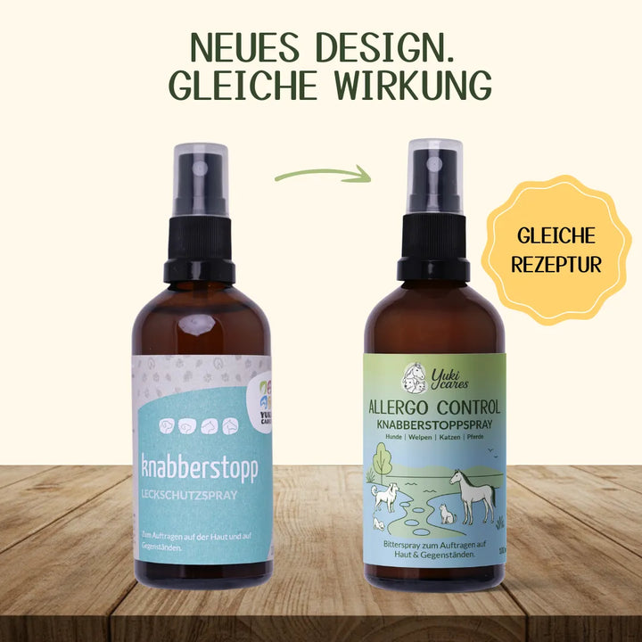 Zwei Flaschen Knabberstopp-Spray mit neuem Design stehen auf einem Holztisch, betont durch "Gleiche Rezeptur".