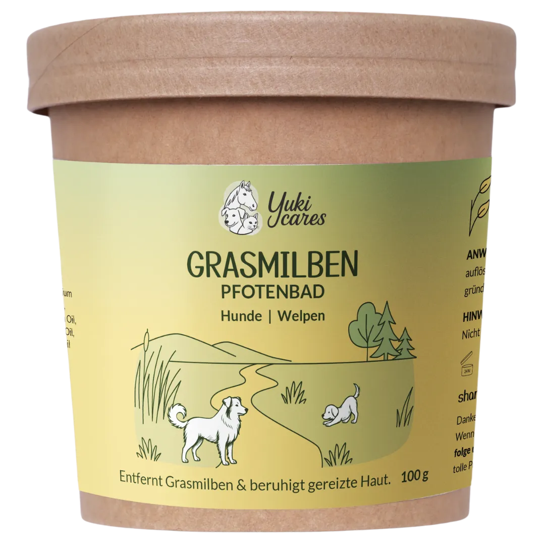 Ein Pfotenbad-Behälter für Hunde und Welpen mit einer Illustration von spielenden Hunden in einer grünen Landschaft.