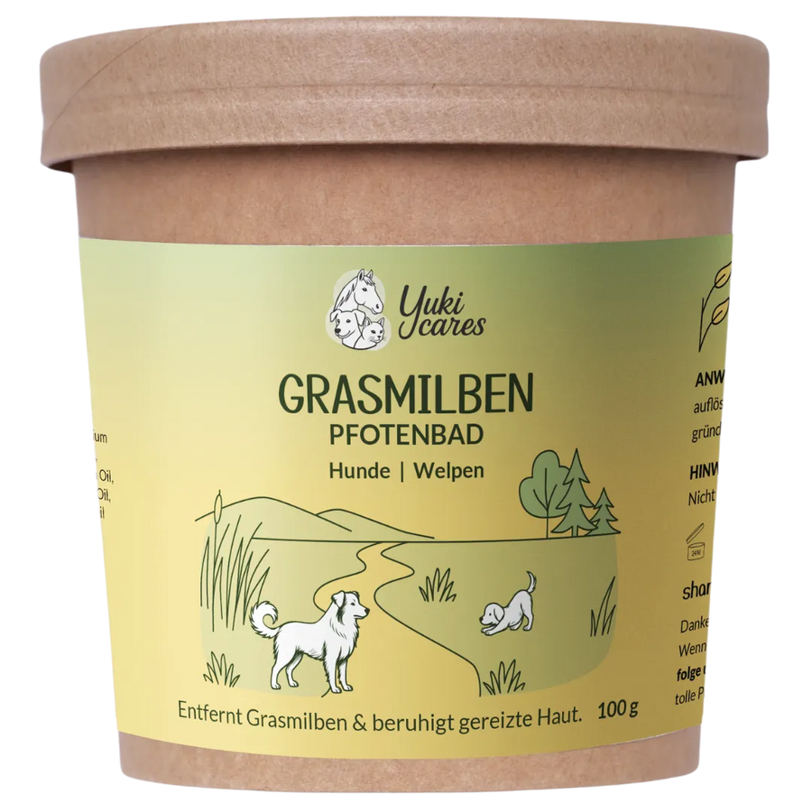 Ein Pfotenbad-Behälter für Hunde und Welpen mit einer Illustration von spielenden Hunden in einer grünen Landschaft.