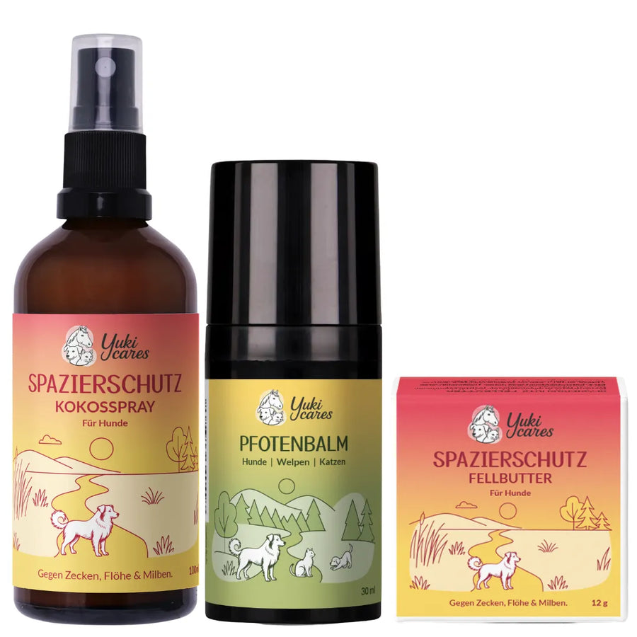 Drei Produkte für den Hundeschutz, darunter ein Kokosspray, ein Pfotenbalsam und ein Fellbutter, stehen nebeneinander.